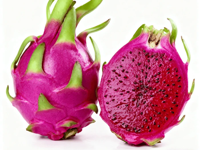 Whole and cut red-fleshed dragon fruit