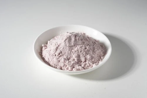 Assay-grade botanical powder presented in a white dish
