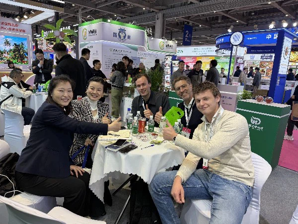 Ms. Liu engages in a productive meeting with international clients at the display area. Ms. Liu engages in a productive meeting with international clients at the display area.