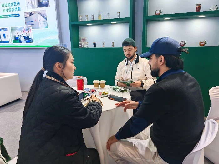 Ms. Liang connects with industry professionals during a busy networking moment. Ms. Liang connects with industry professionals during a busy networking moment.